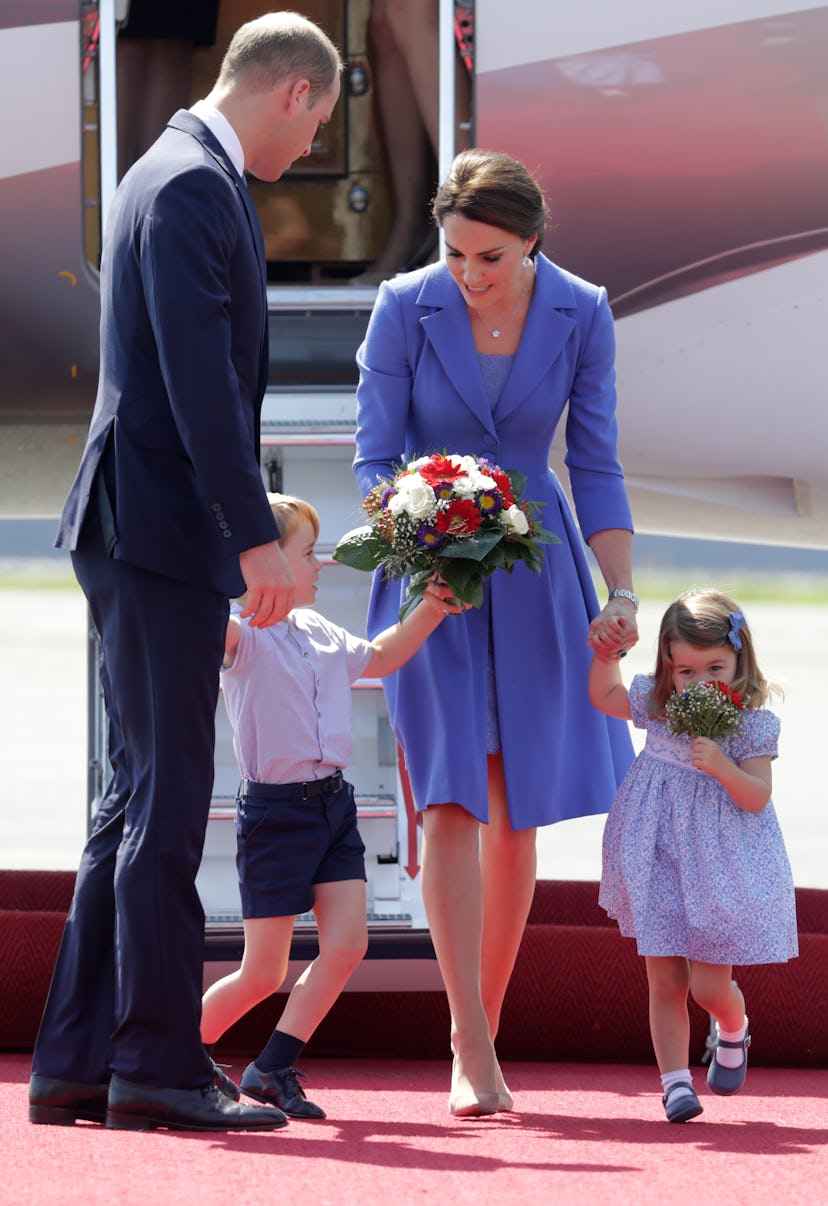 Prince George checks out his mom's flowers.