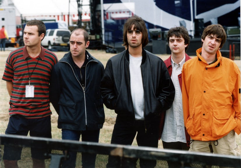 '90s rock group Oasis stand together before a show.