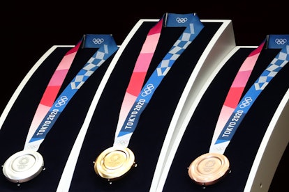 Medals for the Tokyo 2020 Olympic Games are unveiled during a ceremony marking one year before the s...
