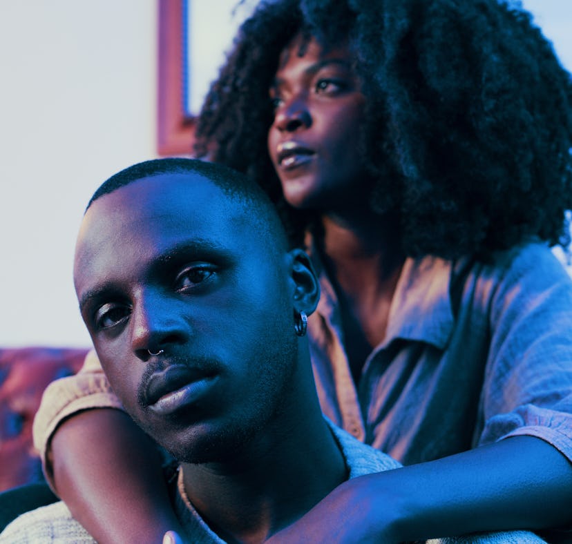 Shot of a young couple relaxing on the sofa at home