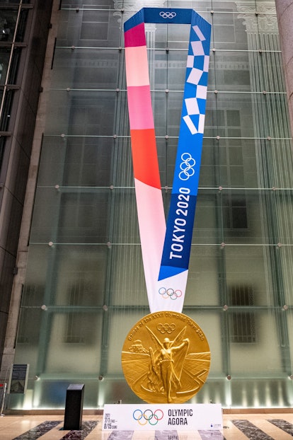 This picture shows a large-scale reproduction of the Tokyo 2020 Olympic Games gold medal as part of ...