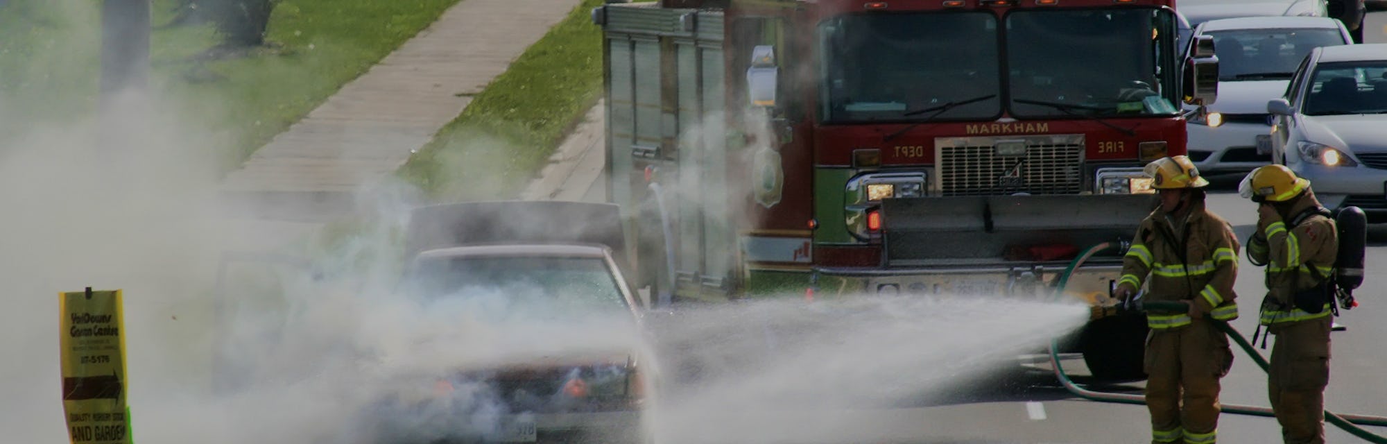 Firemen extinguish an engine fire of an overheated vehicle in Markham, Ontario, Canada, on October 1...