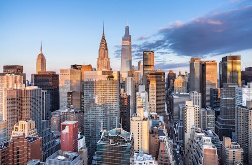 This high angle sunrise view from the far east side of Manhattan looks west toward midtown. Seen pro...