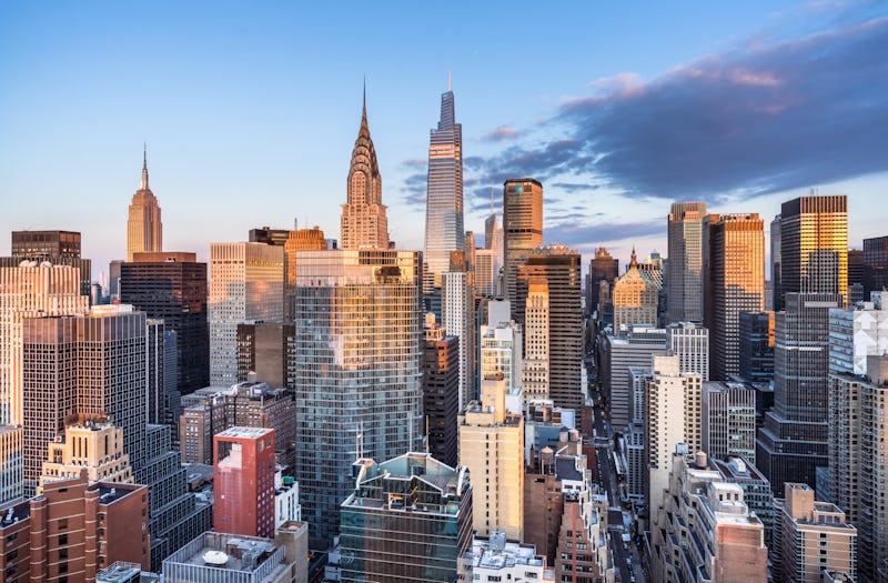 This high angle sunrise view from the far east side of Manhattan looks west toward midtown. Seen pro...