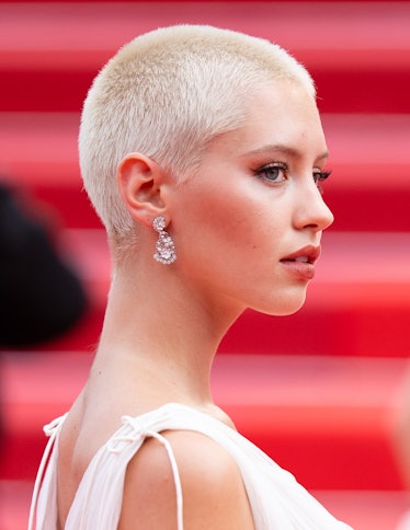 Iris Law in a white dress and crystal earrings at the Cannes Film Festival 2021