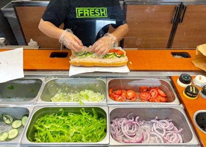 SAN ANSELMO, CALIFORNIA - JUNE 22: A worker at a Subway sandwich shop makes a tuna sandwich on June ...
