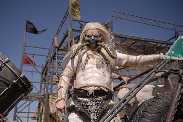 A man in a "Mad Max" Immortan Joe costume poses for pictures during Wasteland Weekend festival at th...