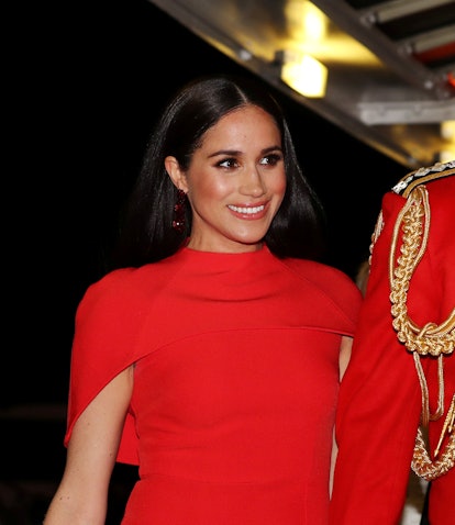 Meghan, Duchess of Sussex arrives with Britain's Prince Harry, Duke of Sussex (not pictured) attend ...