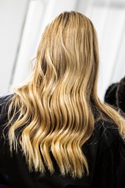 MILAN, ITALY - SEPTEMBER 27: A model, hair detail,  is seen backstage at the Shi.Rt fashion show dur...