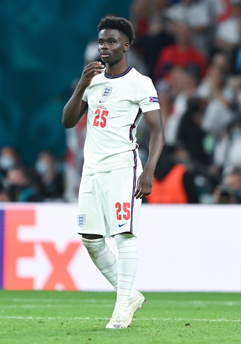 LONDON, ENGLAND - JULY 11: Bukayo Saka of England reacts after his penalty miss during the UEFA Euro...