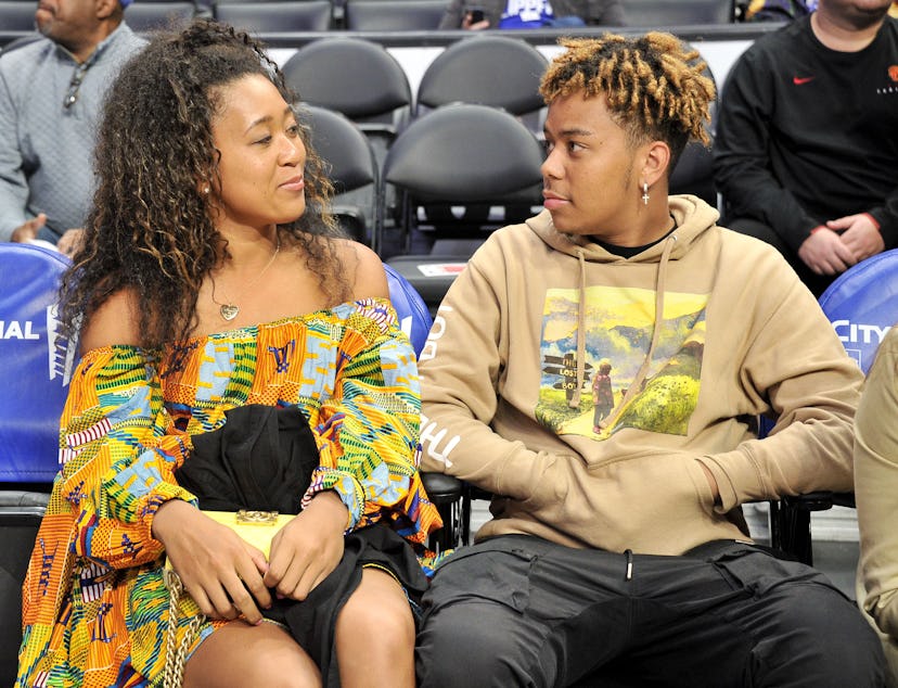 Naomi Osaka and Cordae attend an NBA game in 2019 in Los Angeles.