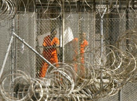 FILES - A picture taken on January 27, 2002 shows a detainee from Afghanistan wiping himself down as...