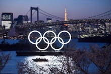 TOKYO, JAPAN - MARCH 25: A boat sails past the Tokyo 2020 Olympic Rings on March 25, 2020 in Tokyo, ...