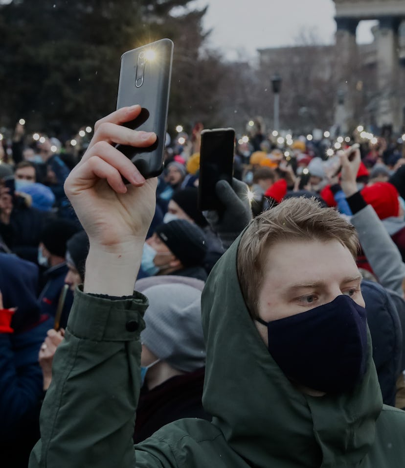 NOVOSIBIRSK, RUSSIA - APRIL 21, 2021: Supporters of Russian opposition activist Alexei Navalny hold ...