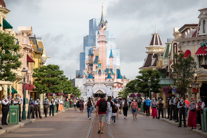 Visitors walk around Disneyland Paris parks following its reopening on June 17, 2021 in Paris, Franc...