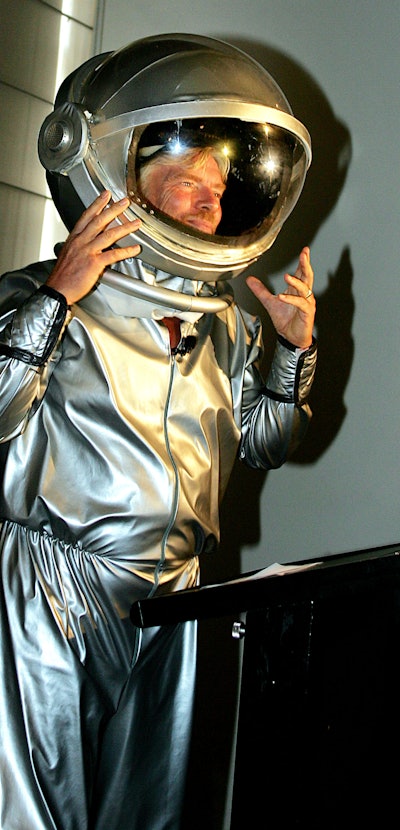 Richard Branson arrives in a space suit for the announcement in Sydney, 13 December 2005, of Austral...