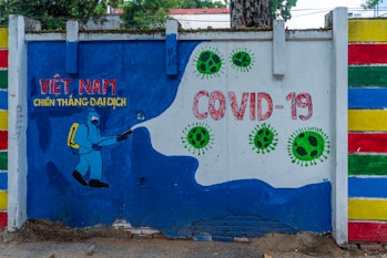 Taken on June 27, 2021 in Hochiminh City, Vietnam. At a corner of a street the wall to propaganda fi...