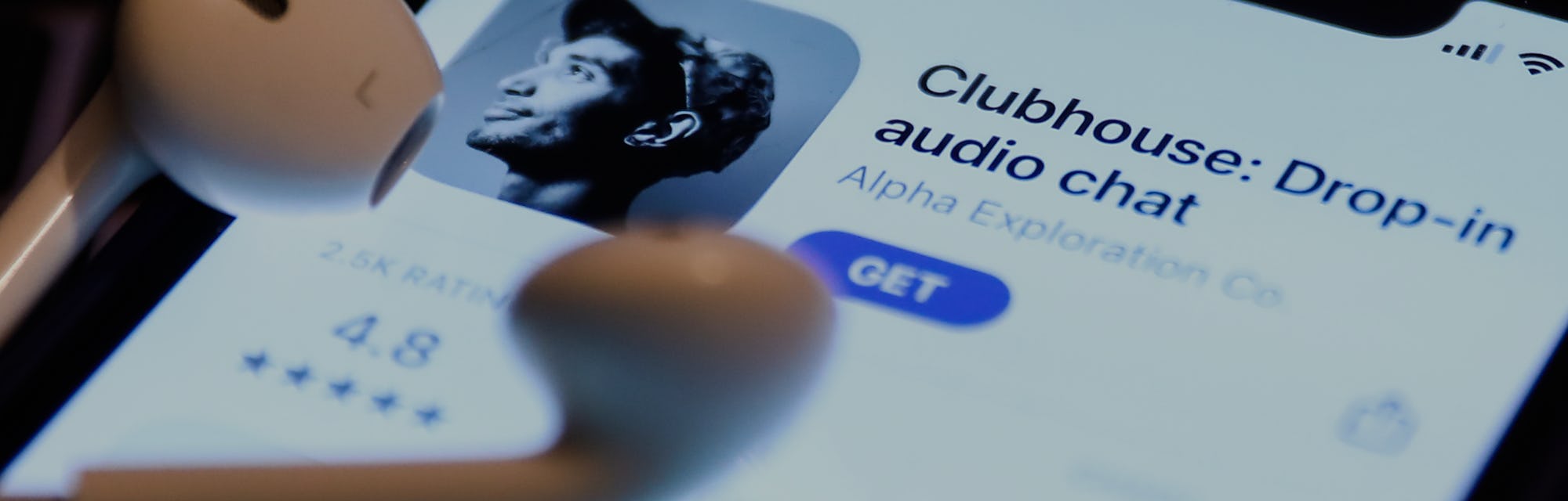 Clubhouse Drop-in audio chat app logo on the App Store is seen displayed on a phone screen in this i...