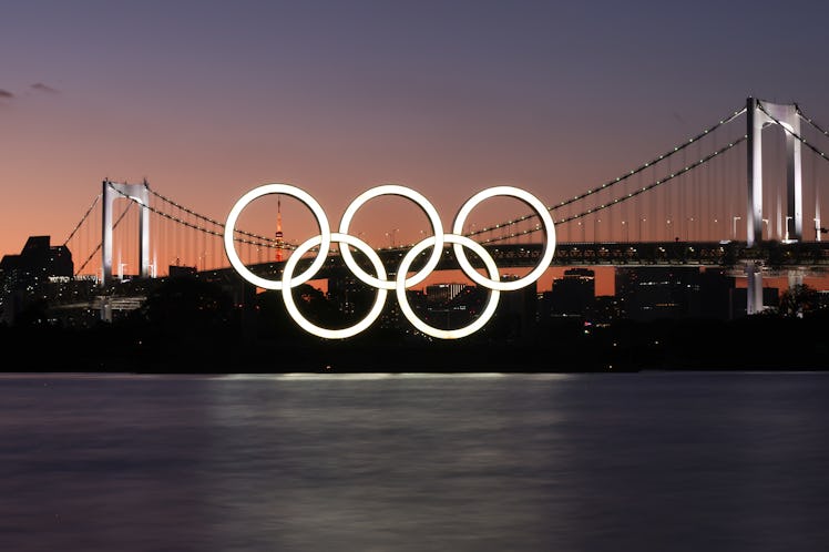 TOKYO, JAPAN - JULY 17, 2021: Olympic rings are pictured with the Rainbow Bridge in the background. ...