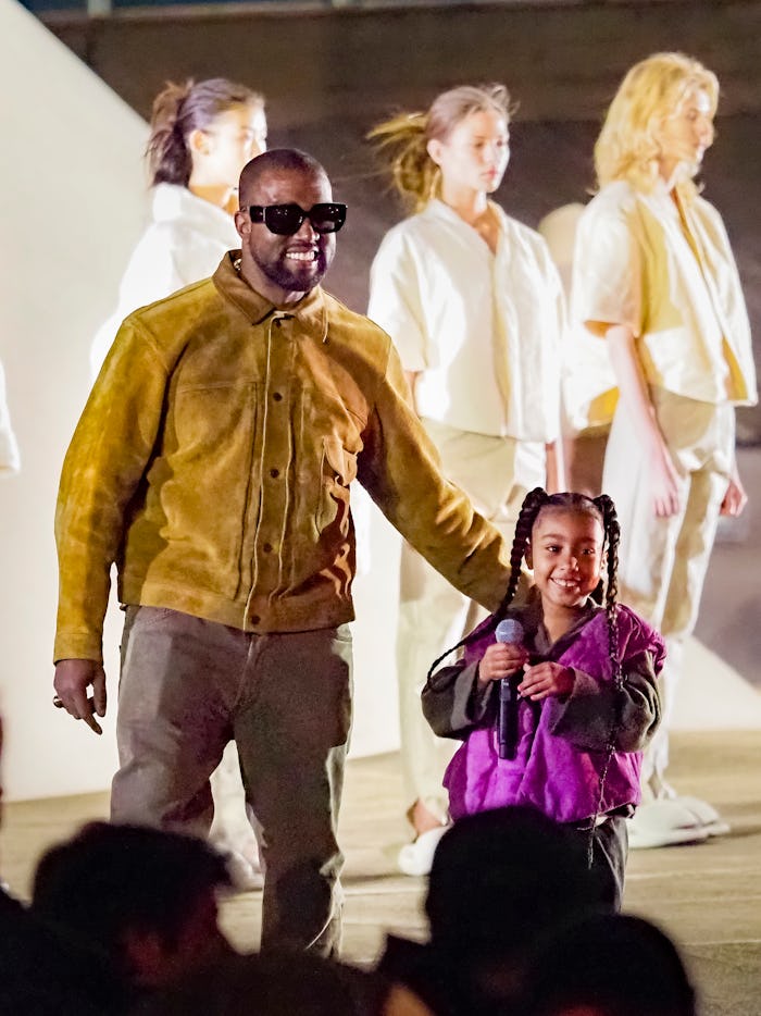 PARIS, FRANCE - MARCH 02: Kanye West and daughter North West attends the "Yeezy Season 8" show as pa...