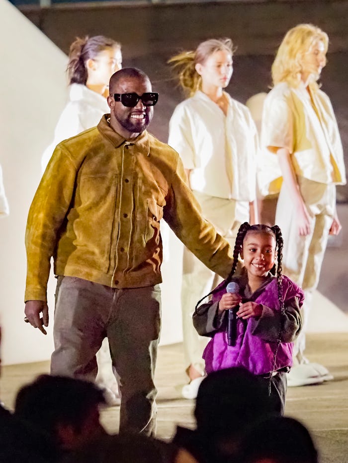 PARIS, FRANCE - MARCH 02: Kanye West and daughter North West attends the "Yeezy Season 8" show as pa...