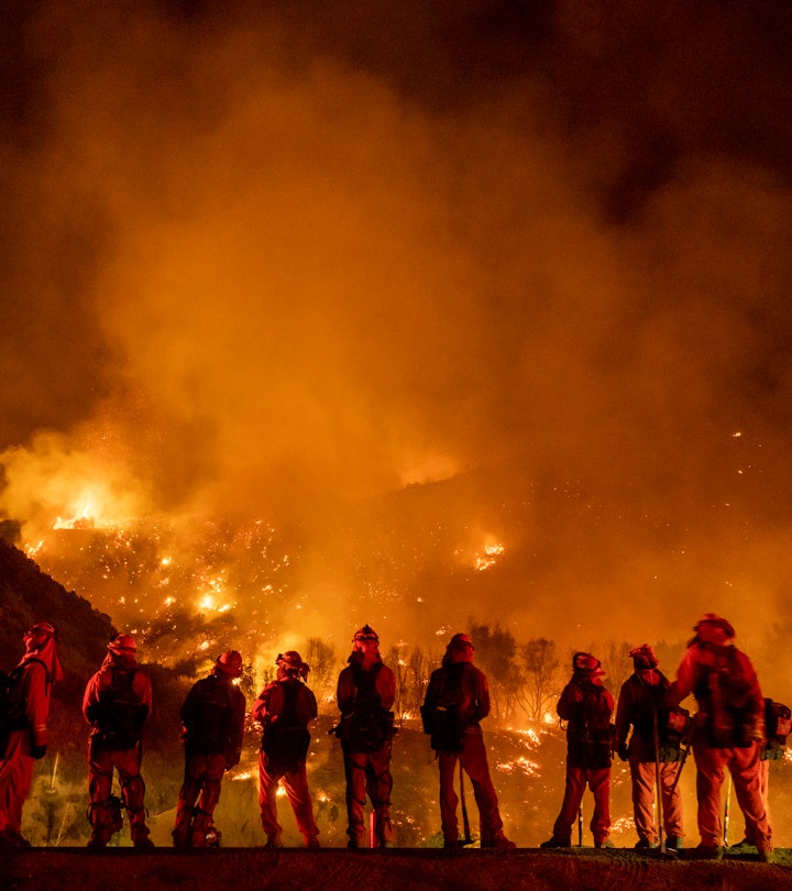 MOUNTAIN HOME VILLAGE, CALIFORNIA - September 9: A group of inmate firefighter watch as the El Dorad...