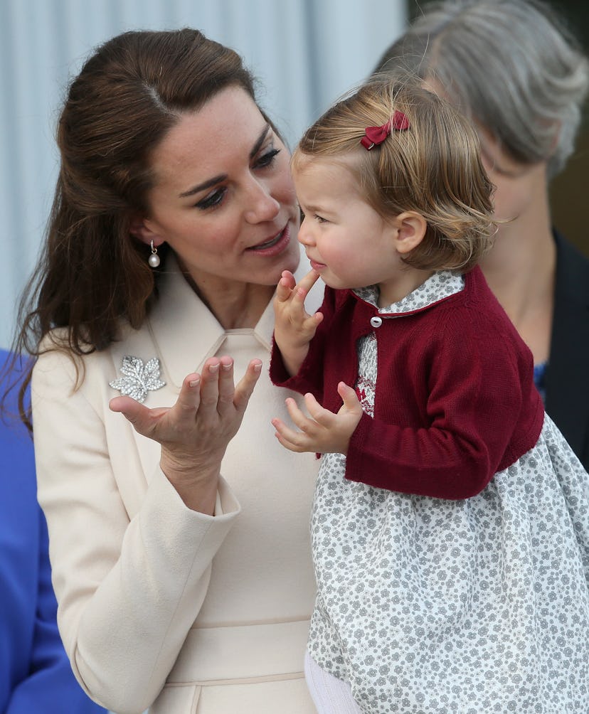 Princess Charlotte having a chat with her mom.