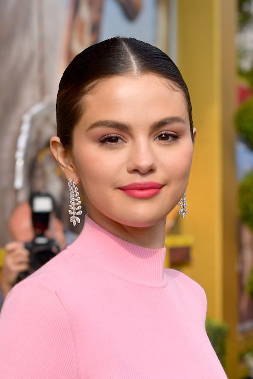 From a seriously fierce cat eye to hot pink eyeshadow to a perfectly peach pout, Selena Gomez is som...