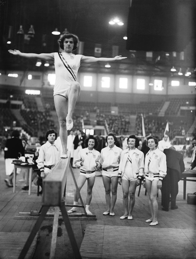 Marian Barone (1924 - 1996) of the USA on the balance beam at Empress Hall, Earl's Court, during the...