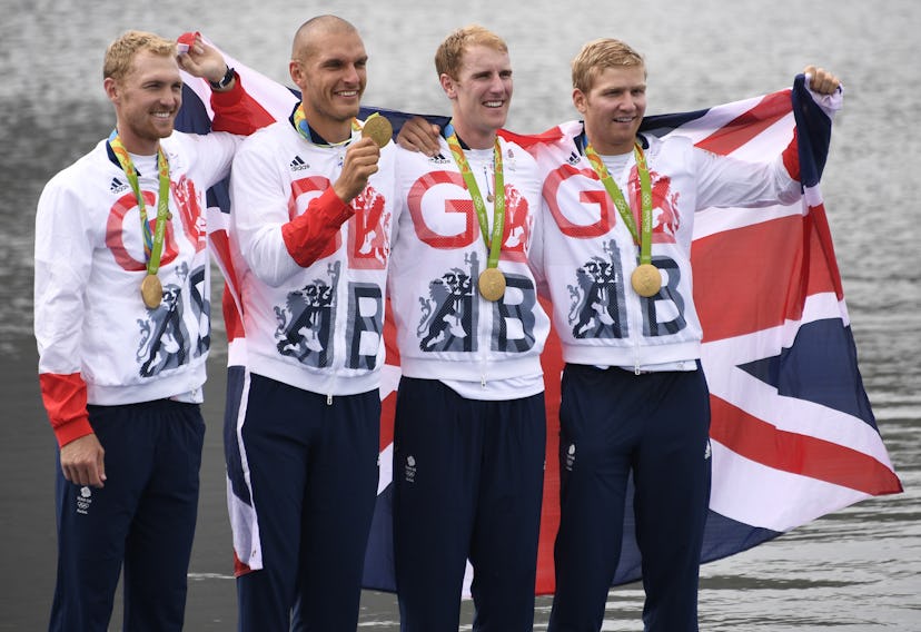 Britain's Mohamed Sbihi, Alex Gregory, Constantine Louloudis and George Nash pose with their gold me...