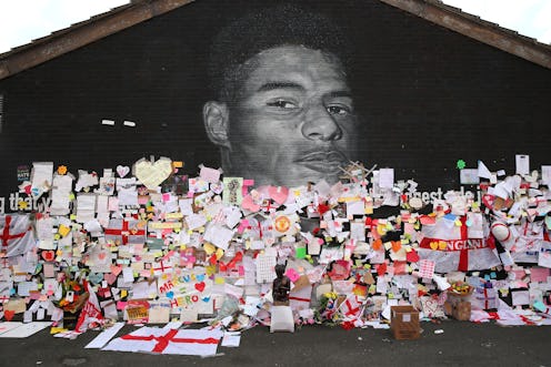 Messages are seen at the newly repaired mural of England footballer Marcus Rashford by the artist kn...