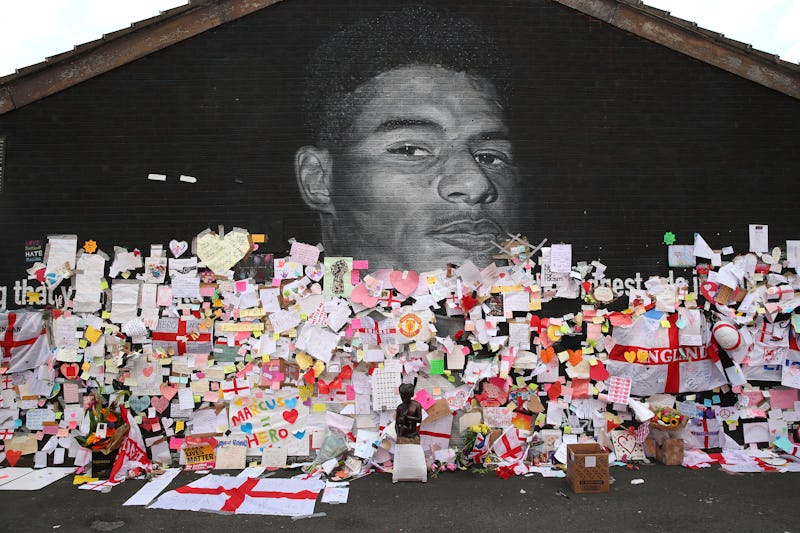 Messages are seen at the newly repaired mural of England footballer Marcus Rashford by the artist kn...