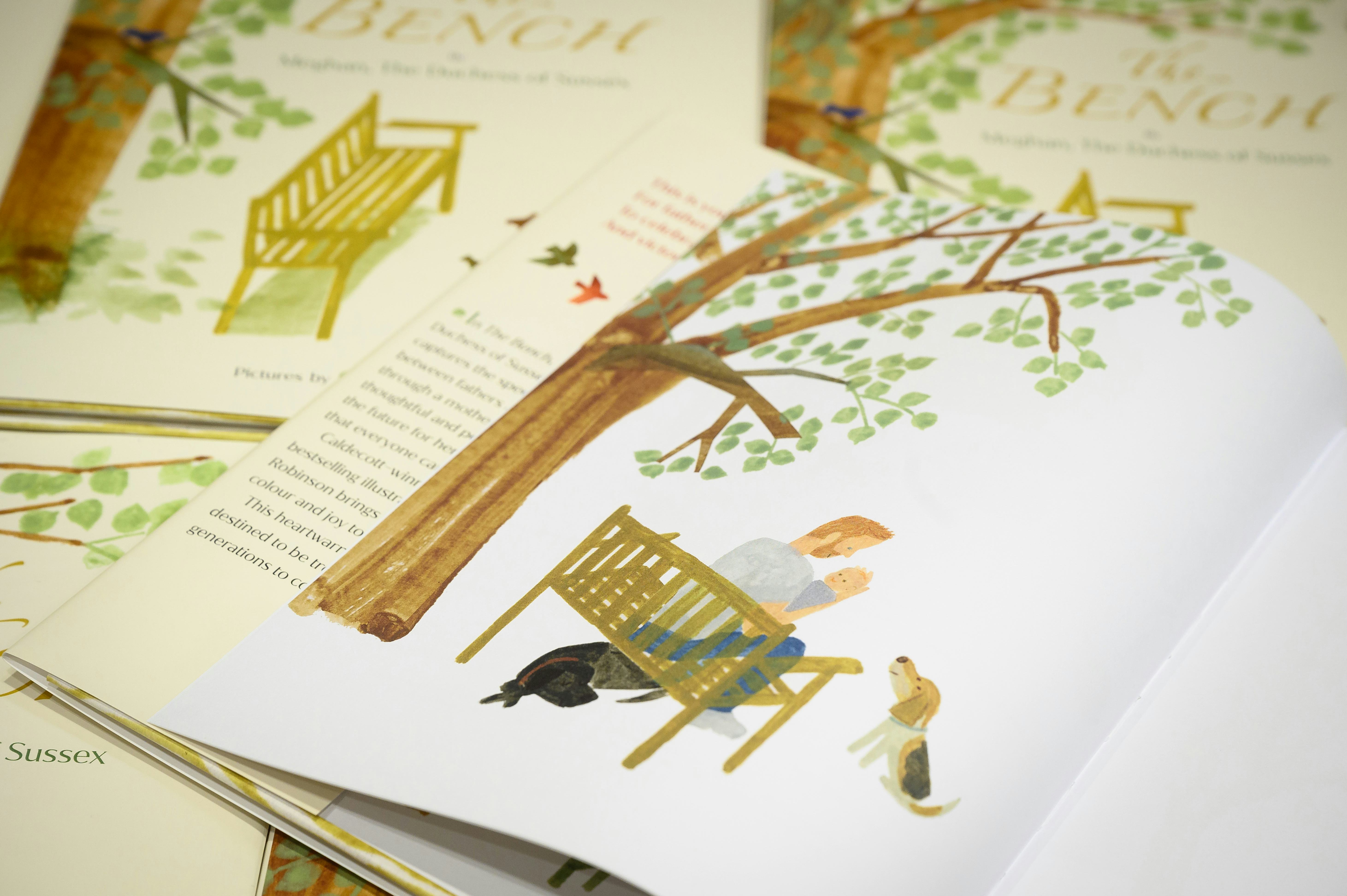 LONDON, ENGLAND - JUNE 08: A illustration of a father and son are seen inside a copy of Meghan Markl...