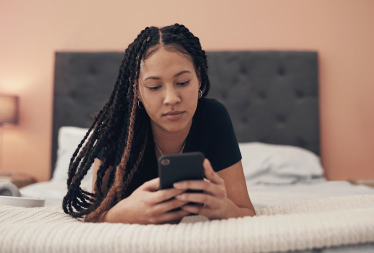 A woman reads a drunk text from her ex.