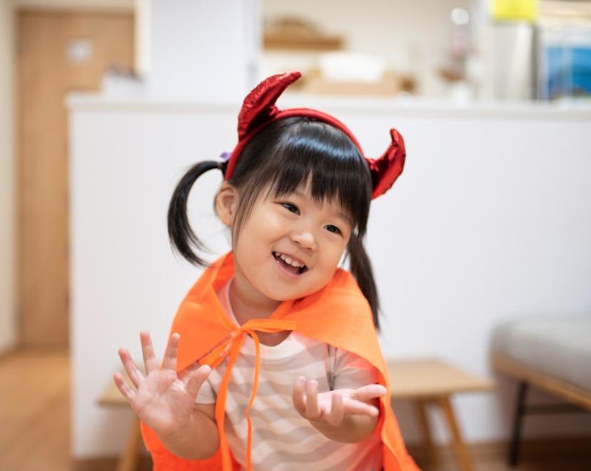 Asian child wearing Halloween costume