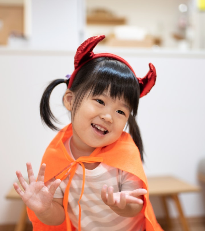Asian child wearing Halloween costume