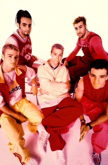 Justin Timberlake, Chris Kirkpatrick, Lance Bass, Joey Fatone, and C Chasez posing for a portrait 
