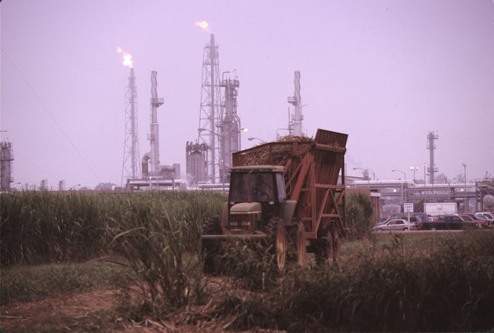 BATON ROUGE, LA- OCTOBER: Oil and chemical refinery plants cover the landscape, next to African Amer...