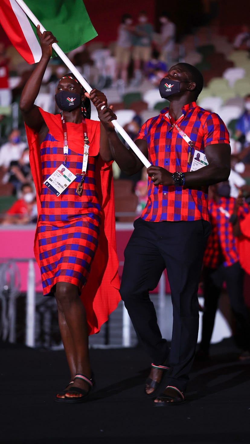 TOKYO, JAPAN - JULY 23: Flag bearers Mercy Moim and Andrew Amonde of Team Kenya lead their team duri...