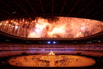 TOKYO, JAPAN - JULY 23: General view inside the stadium as fireworks go off as the Olympic cauldron is lit during the Opening Ceremony of the Tokyo 2020 Olympic Games at Olympic Stadium on July 23, 2021 in Tokyo, Japan. (Photo by Leon Neal/Getty Images)