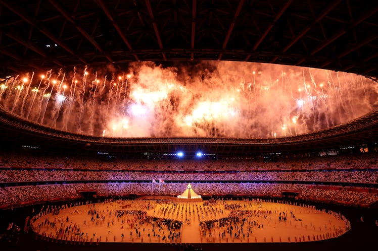 TOKYO, JAPAN - JULY 23: General view inside the stadium as fireworks go off as the Olympic cauldron ...