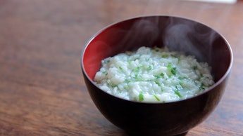 Rice porridge with seven herbs of spring called Nanakusa Gayu in lacquered bowl on January 7th in Ky...