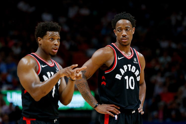 MIAMI, FL - APRIL 11:  DeMar DeRozan #10 and Kyle Lowry #7 of the Toronto Raptors look on against th...