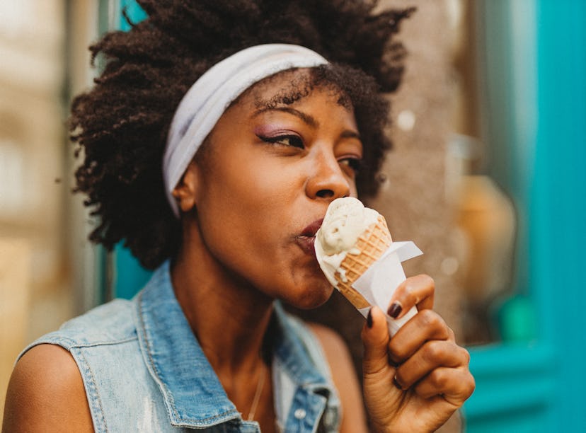 Woman eating her favorite ice cream the week of Aug. 23, 2021, which will be the best for her zodiac...