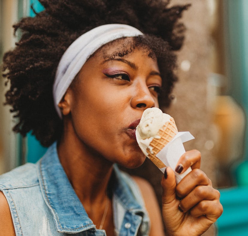 Woman eating her favorite ice cream the week of Aug. 23, 2021, which will be the best for her zodiac...