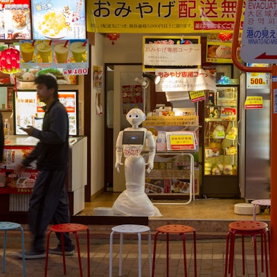 OMOTESANDO, JAPAN - 2016/07/29: A humanoid Pepper robot welcomes people to a restaurant in Yokohama ...