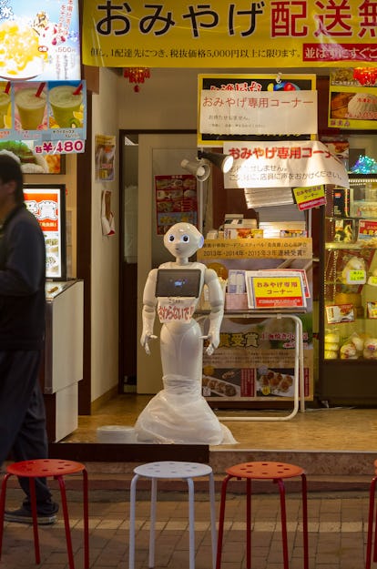 OMOTESANDO, JAPAN - 2016/07/29: A humanoid Pepper robot welcomes people to a restaurant in Yokohama ...