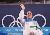 Oksana Chusovitina of Uzbekistan reacts after the women's artistic gymnastics qualification at the T...