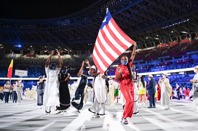 TOKYO, JAPAN - JULY 23: Flag bearers Ebony Morrison and Joseph Fahnbulleh of Team Liberia walk their team out during the Opening Ceremony of the Tokyo 2020 Olympic Games at Olympic Stadium on July 23, 2021 in Tokyo, Japan. (Photo by Matthias Hangst/Getty Images)