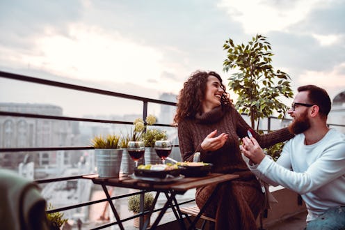 Male Using Rooftop Dinner Date To Propose To Girlfriend